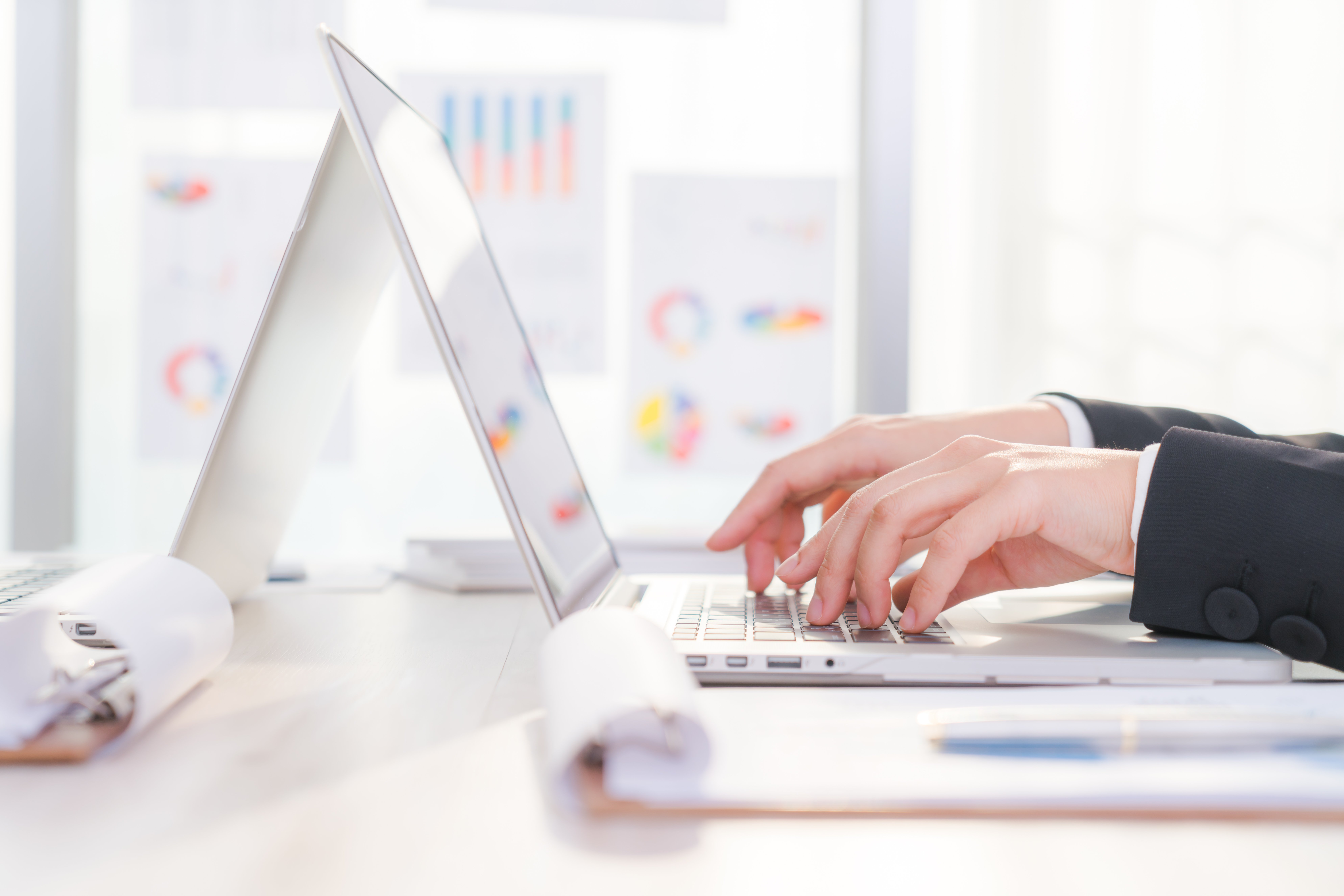 closeup-of-business-woman-hand-typing-on-laptop-keyboard